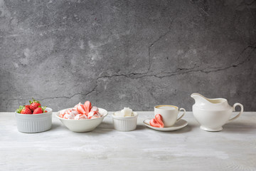 Beautiful romantic breakfast with coffee and meringue cookies in the shape of hearts. White set...