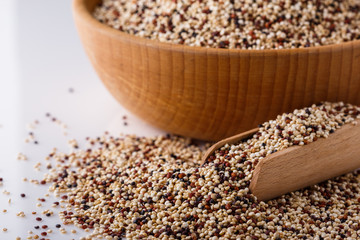 mix of quinoa grains on white acrylic background