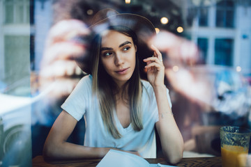Attractive female student chilling in cafe