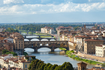 Fototapeta na wymiar View of medieval stone bridge Ponte Vecchio over Arno river in Florence, Tuscany, Italy.