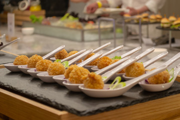 Croquettes on a decorated catering banquet table in the self service restaurant of hotel, party wedding birthday conference christmas celebration buffet.