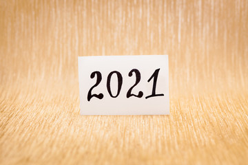 Happy new year 2021 - card with numbers on glitter gold background	