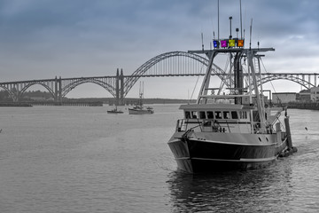 Fototapeta premium Fishing vessel returning to port Newport OR.