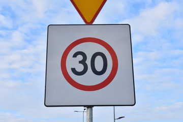 Speed limit 30 (thirty) road sign, closeup - 317108260