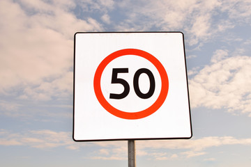 Speed limit 50 (fifty) road sign, closeup - 317108262