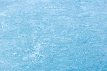 Abstract ice texture. Nature blue background. Traces of blades of skates on ice