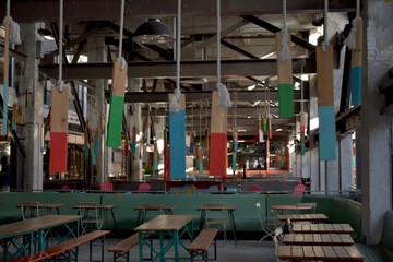 Colorful wooden ornaments hanging at a food court