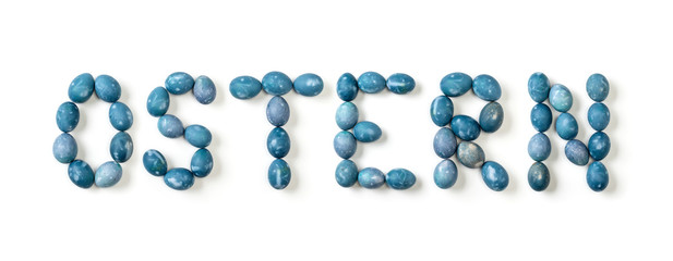 Ostern written with aquamarine eggs