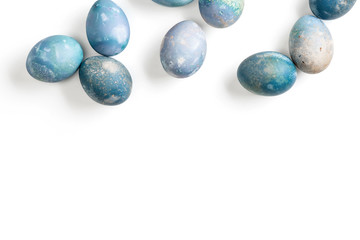 Aquamarine easter eggs in wooden bowl isolated on white