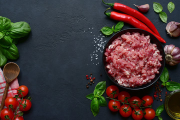 Homemade minced meat with vegetables and spices. Top view with copy space.