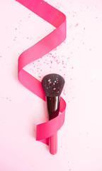 Make Up brush with pink glitter wrapped in ribbon