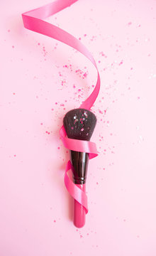 Make Up brush with pink glitter wrapped in ribbon