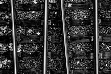 black and white railway tracks from above