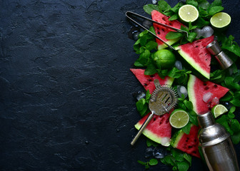 Ingredients for making watermelon mojito - delicious summer cocktail. Top view with copy space.