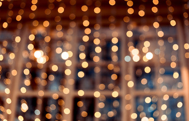 Decorative outdoor string lights at night time, Defocused Background, night city life backdrop, party time with Yellow bokeh balls