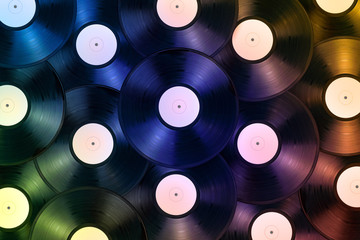Pile of vinyl records as colorful background. Flat lay