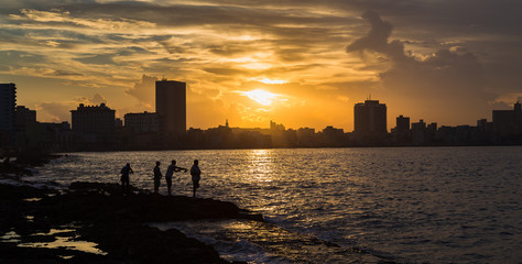 Fishing at sunset in Havana