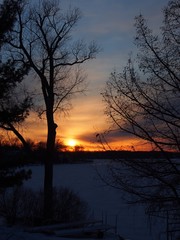 Fototapeta na wymiar Winter Sunrise on Snow Covered Lake Lansing