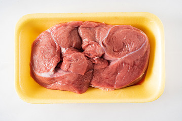 veal meat on the white
