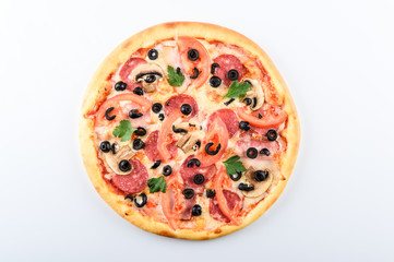  pizza with ham cheese sausage tomatoes and olives on a light background