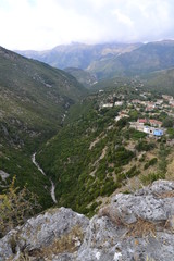 View of Himare, mountains and the bed of a dried river, Albania.