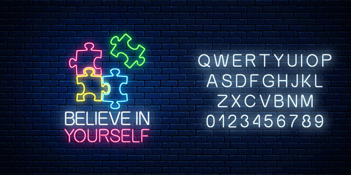 Neon sign of believe in yourself inscription with puzzle pieces and alphabet. Solve puzzle game. Glowing neon icon