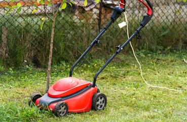 lawn mower working in the town park