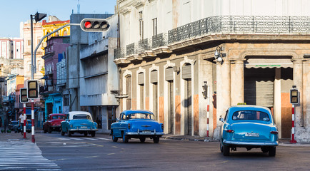 Trio of blue classical cars