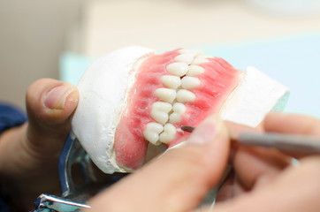 Dental laboratory work, polishing teeth and prostheses