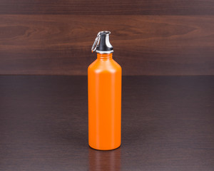 Tourist aluminum water bottle in orange color.