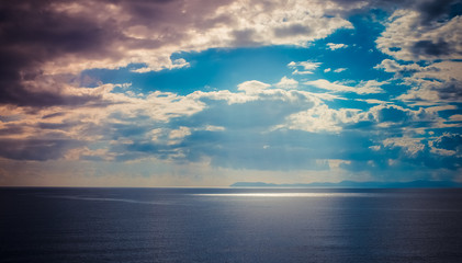 Naklejka na ściany i meble Seascape, blue sky background with clouds