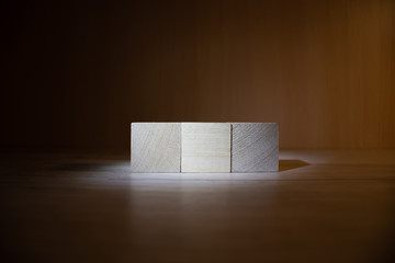 Tower of four wooden cubes, isolated on white background