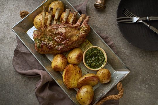 Roasted rack of lamb with spicy rosemary sauce and potatoes