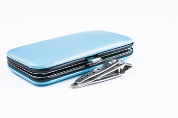  Set of tools for manicure in blue box isolated on white background. Copy space.