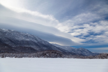 Velebit mountain seen from Lika during winter with snow on a sunny day, Croatia