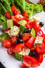 greek salad on dark wooden rustic background