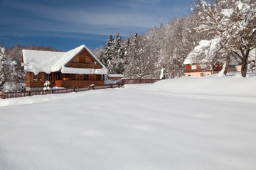 Winter with deep now in wooden village in Lika, Croatia