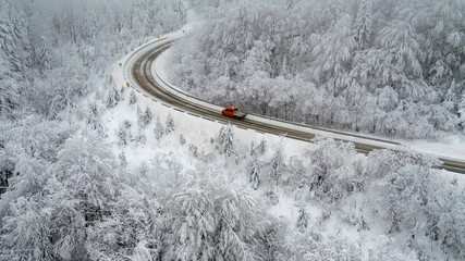 Road in s mountain during winter in Lika, Croatia