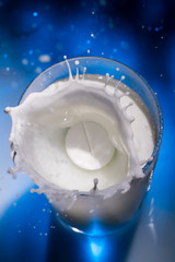 Soluble tablet drops in a glass