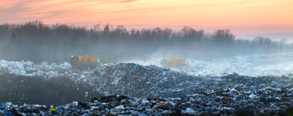 dump trucks on the trash