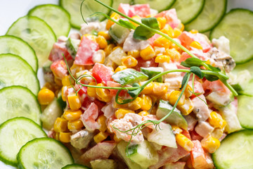 Fresh salad of vegetables and meat on wooden rustic background