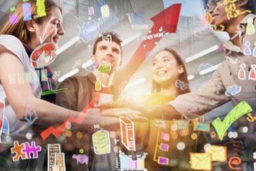 Business person put their hands together. Sketch of a project in overlay. Concept of teamwork,...
