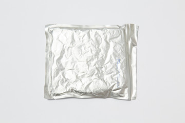Use less plastic! Food in plastic packaging isolated on white ground. Symbol for environmental...
