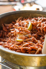 chef cooks shrimp at street food festival