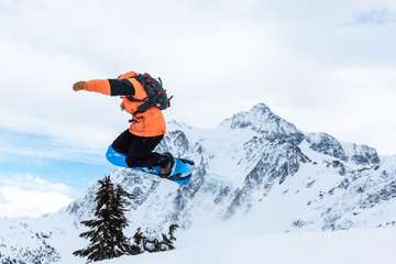 Naklejka na ściany i meble Snowboarder in front of Mt. Shucksan in Winter