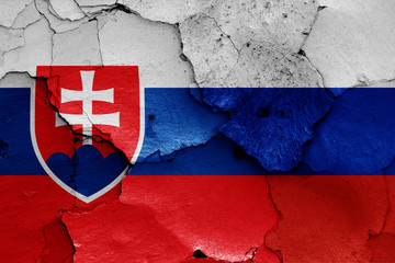 flags of Slovakia and Russia painted on cracked wall © daniel0