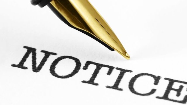 Close up of fountain pen on notice