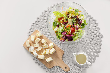 Healthy breakfast of fresh salad and cheese