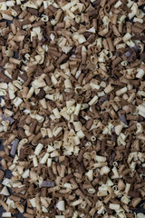 Confectionery pastry decor: chocolate chips on a black background