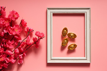 Chinese New Year concept with frame and ingots